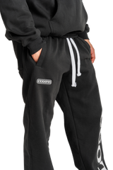 CUOTTI Distressed Black Trousers